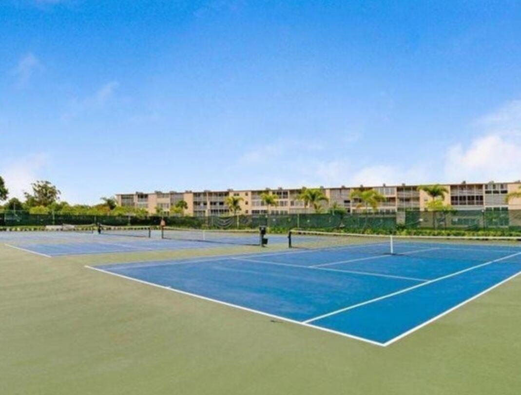 198 Preston Way, Unit 198 Boca Raton, FL 33434 - Photo 16 of 16 a view of an outdoor space and tennis court