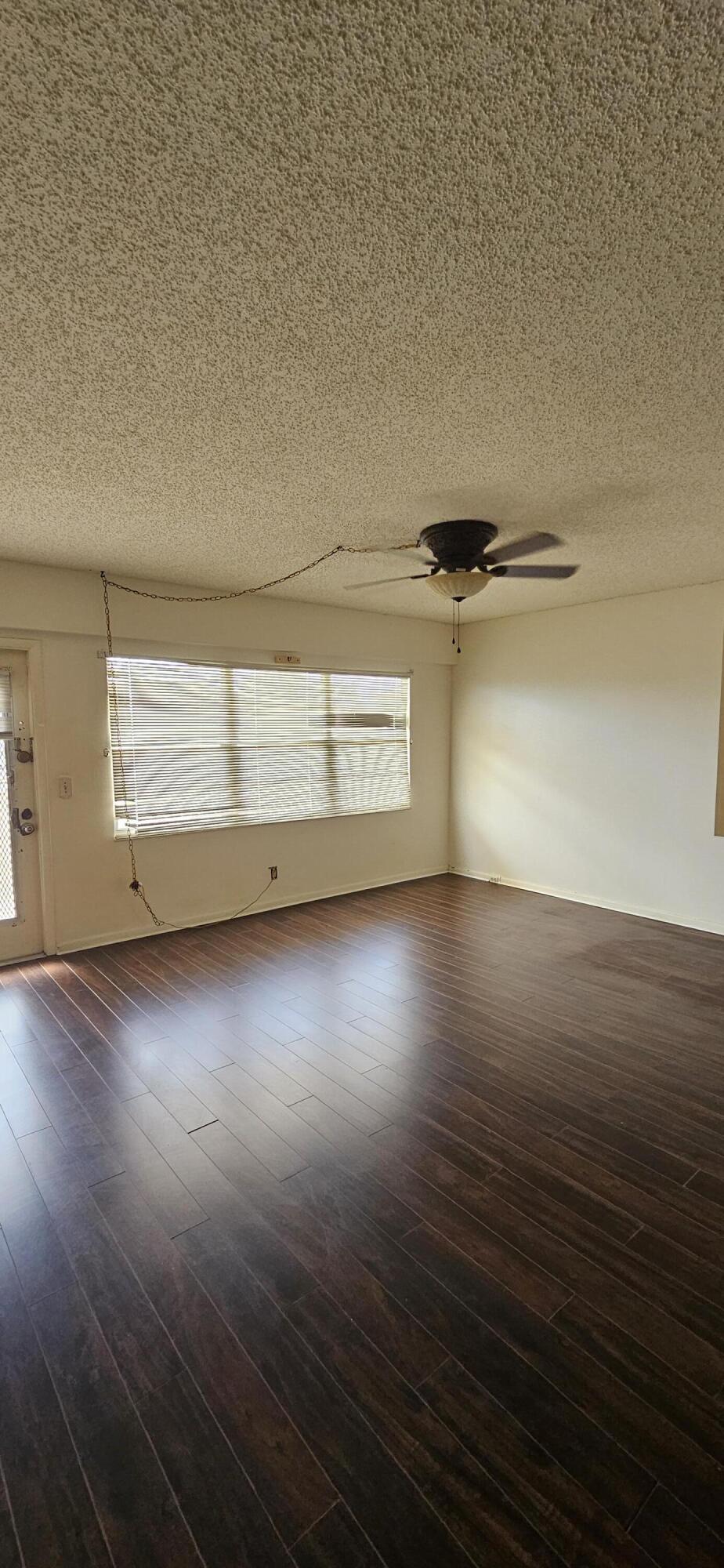 198 Preston Way, Unit 198 Boca Raton, FL 33434 - Photo 3 of 16 a view of a room with wooden floor