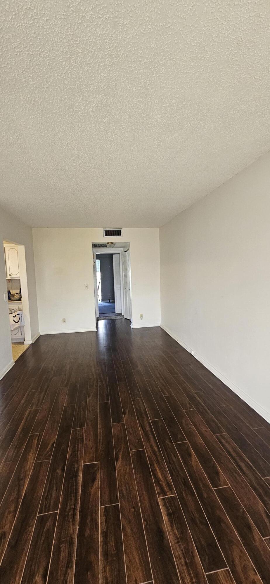 198 Preston Way, Unit 198 Boca Raton, FL 33434 - Photo 4 of 16 a view of a room with wooden floor