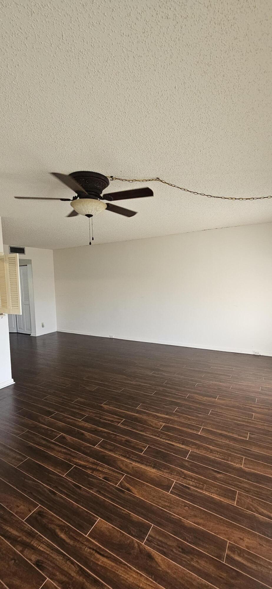 198 Preston Way, Unit 198 Boca Raton, FL 33434 - Photo 5 of 16 a view of a room with wooden floor