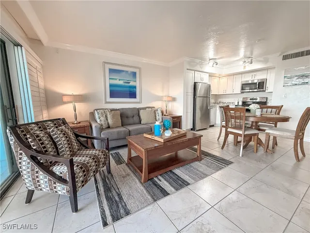 a living room with furniture and a table