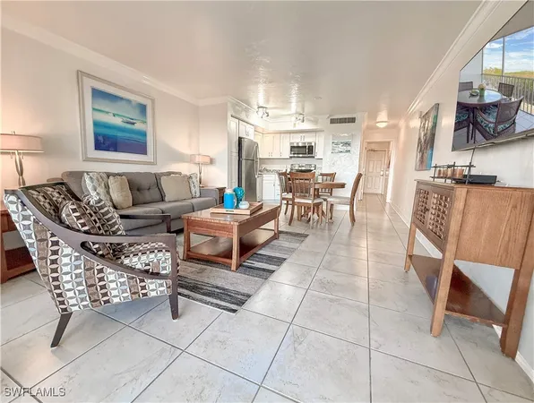 a living room with furniture a dining table and a stove top oven