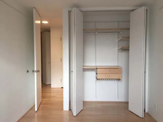 a view of a room with wooden floor