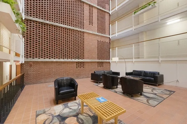 a workspace with furniture and rug