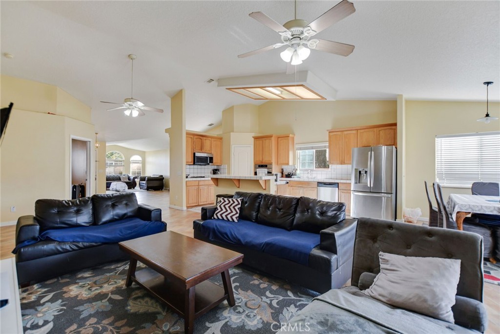 12794 Rain Shadow Road Victorville, CA 92395 - Photo 23 of 50 a view of a living room and a couch
