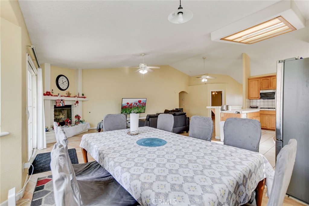 12794 Rain Shadow Road Victorville, CA 92395 - Photo 25 of 50 a large kitchen with a table and chairs