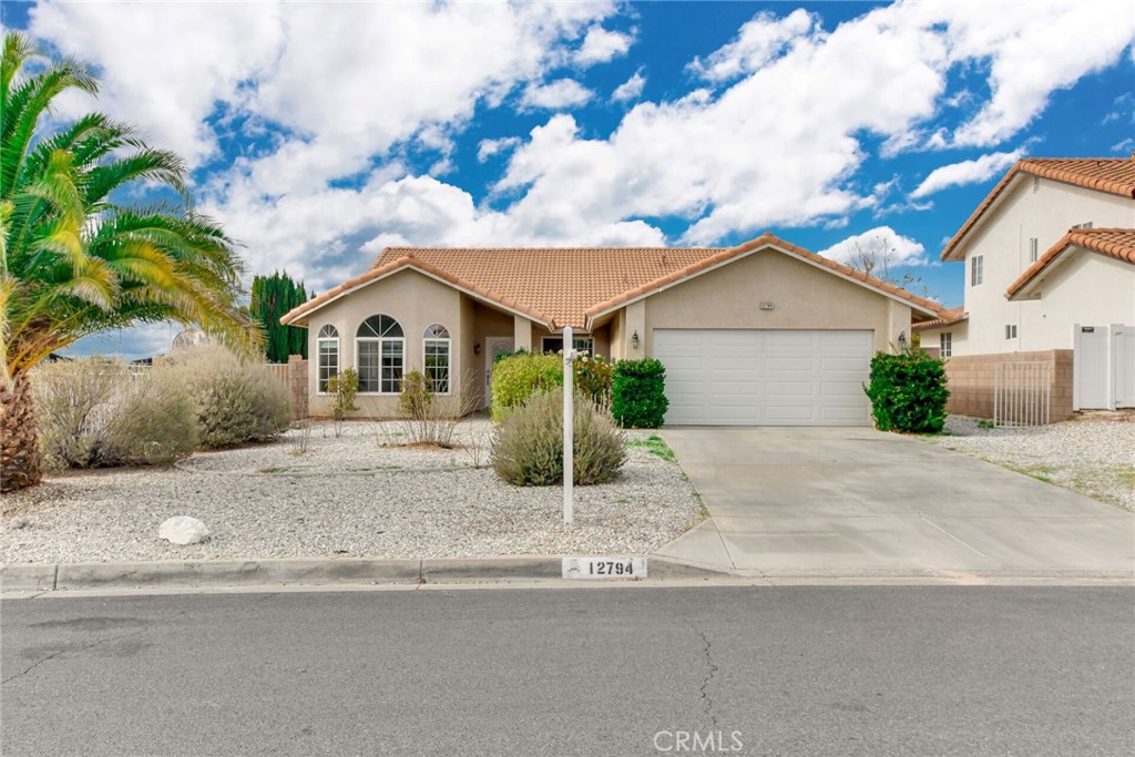 12794 Rain Shadow Road Victorville, CA 92395 - Photo 40 of 50 a view of a yard in front view of a house
