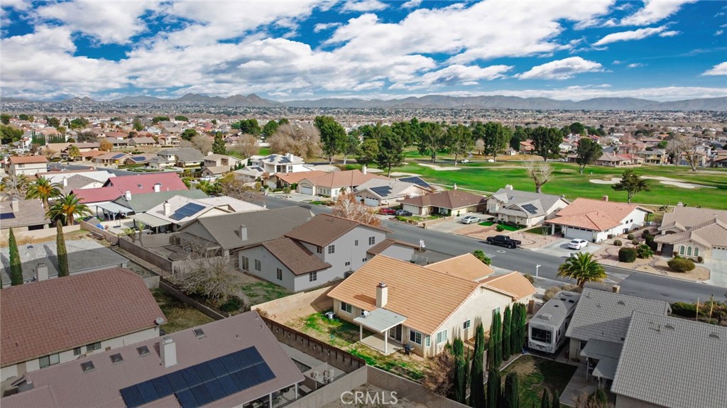 12794 Rain Shadow Road Victorville, CA 92395 - Photo 45 of 50 an aerial view of a house with garden space and ocean view in back