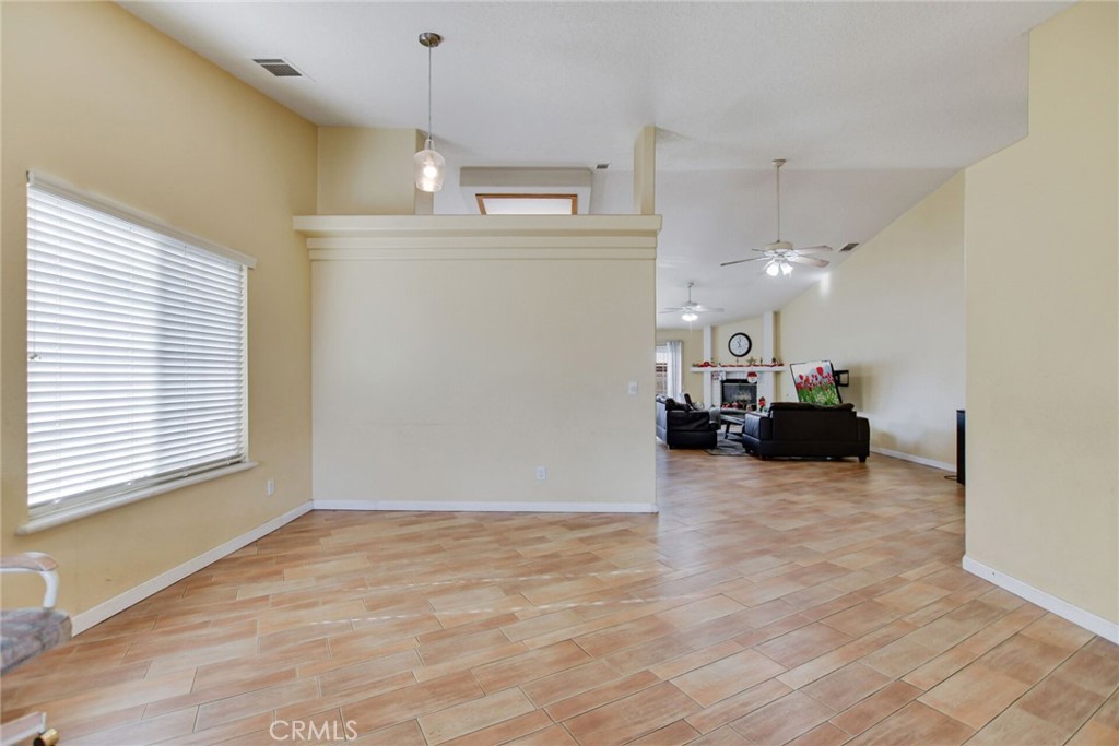 12794 Rain Shadow Road Victorville, CA 92395 - Photo 7 of 50 a view of a livingroom with furniture and a window