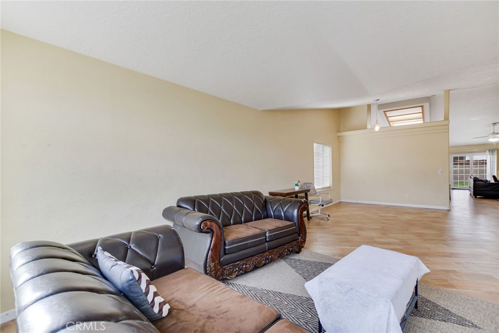 12794 Rain Shadow Road Victorville, CA 92395 - Photo 9 of 50 a living room with furniture and a couch