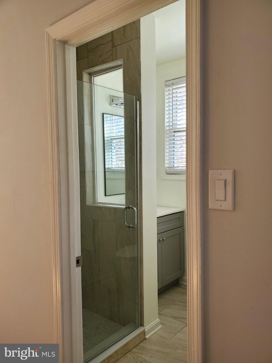 1200 D Street Northeast Washington, DC 20002 - Photo 16 of 35 a view of a bathroom that has a glass door