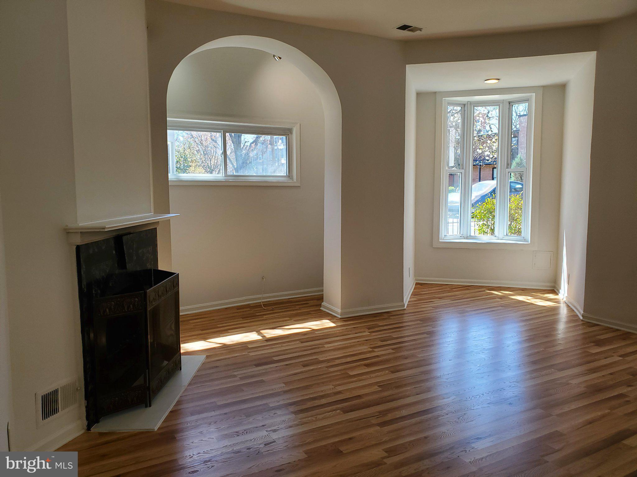 1200 D Street Northeast Washington, DC 20002 - Photo 25 of 35 a view of an empty room with wooden floor and a window