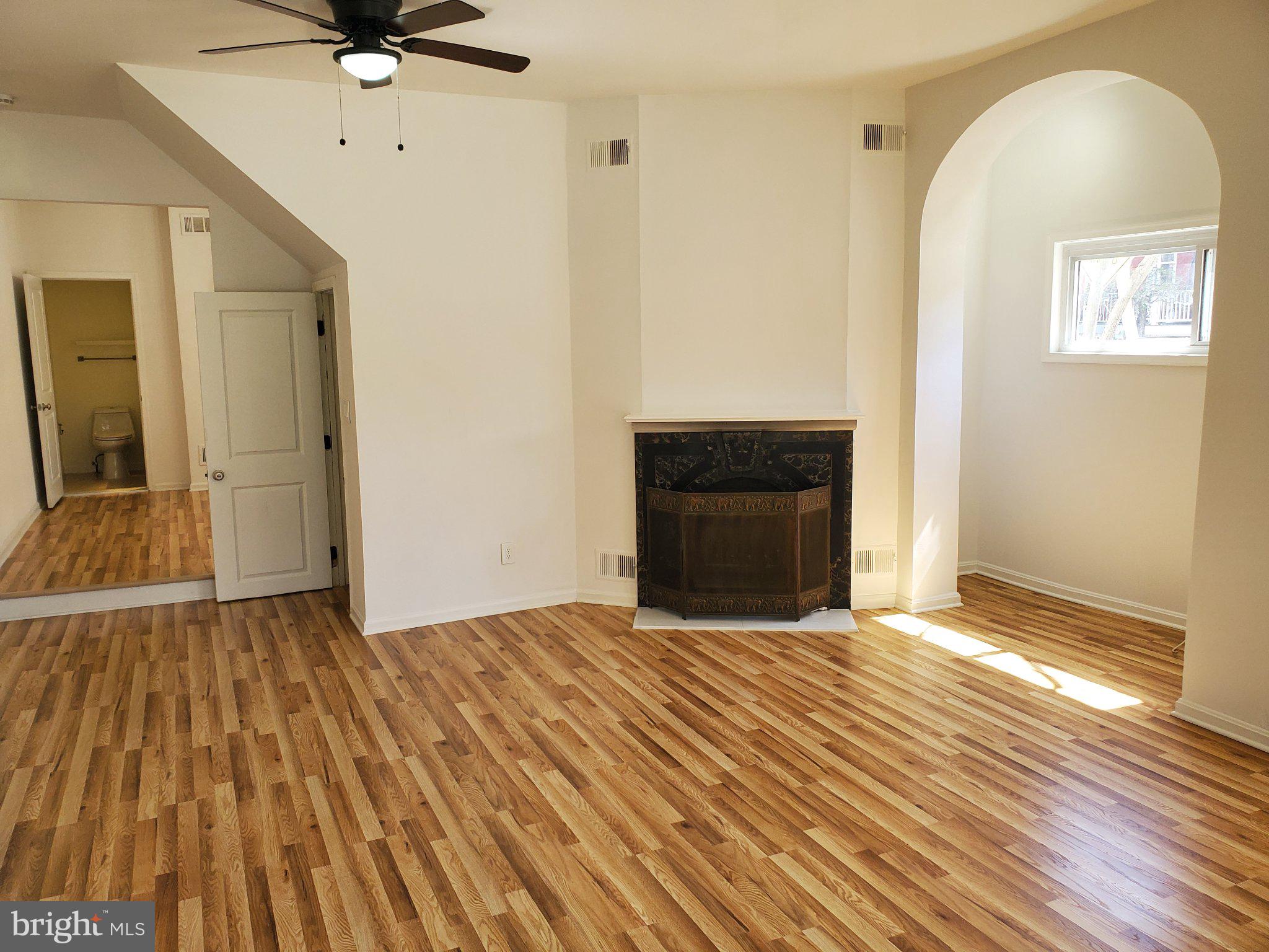 1200 D Street Northeast Washington, DC 20002 - Photo 26 of 35 a view of an empty room with a fireplace and a window