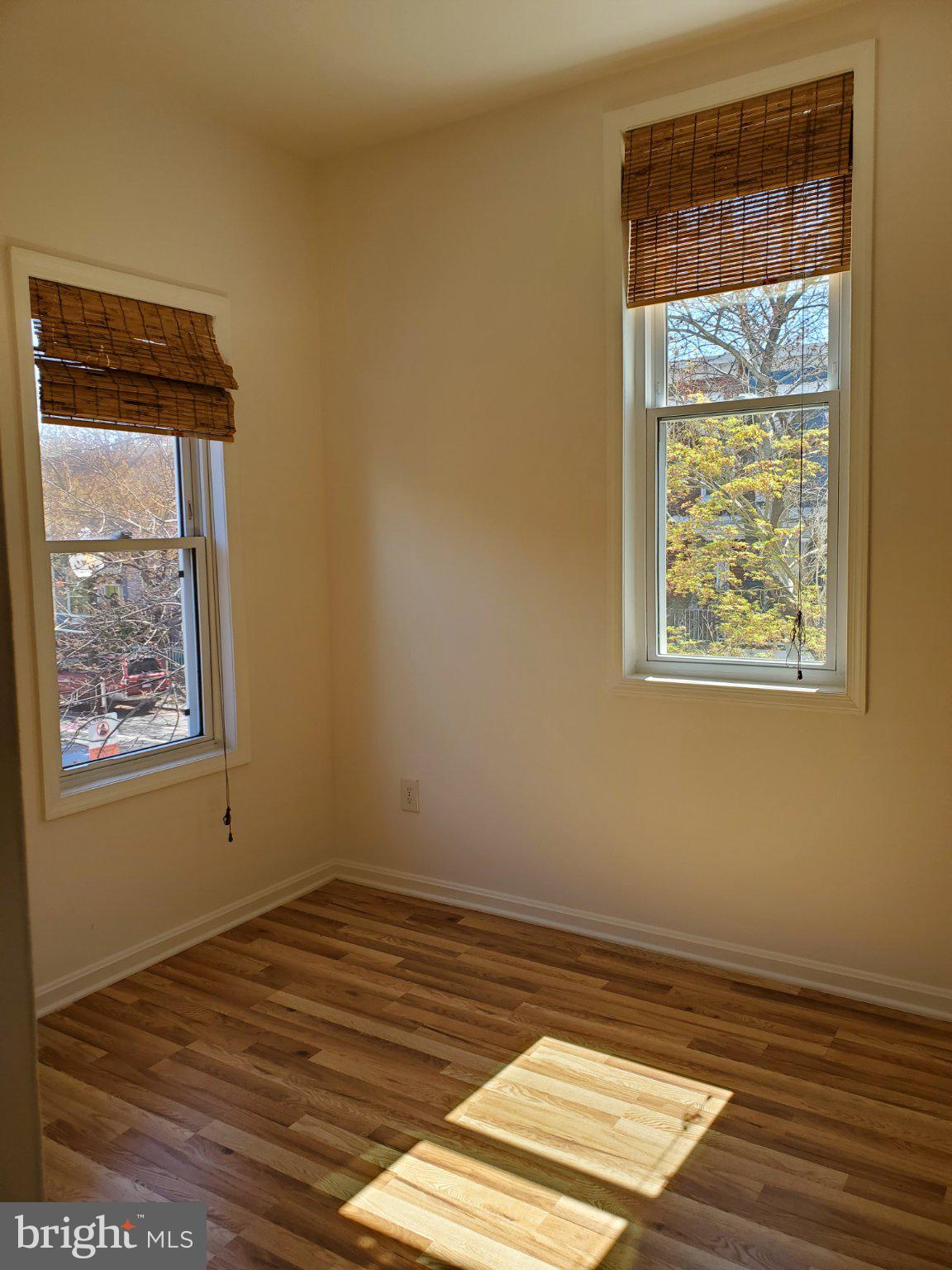1200 D Street Northeast Washington, DC 20002 - Photo 8 of 35 a view of an empty room with wooden floor and a window