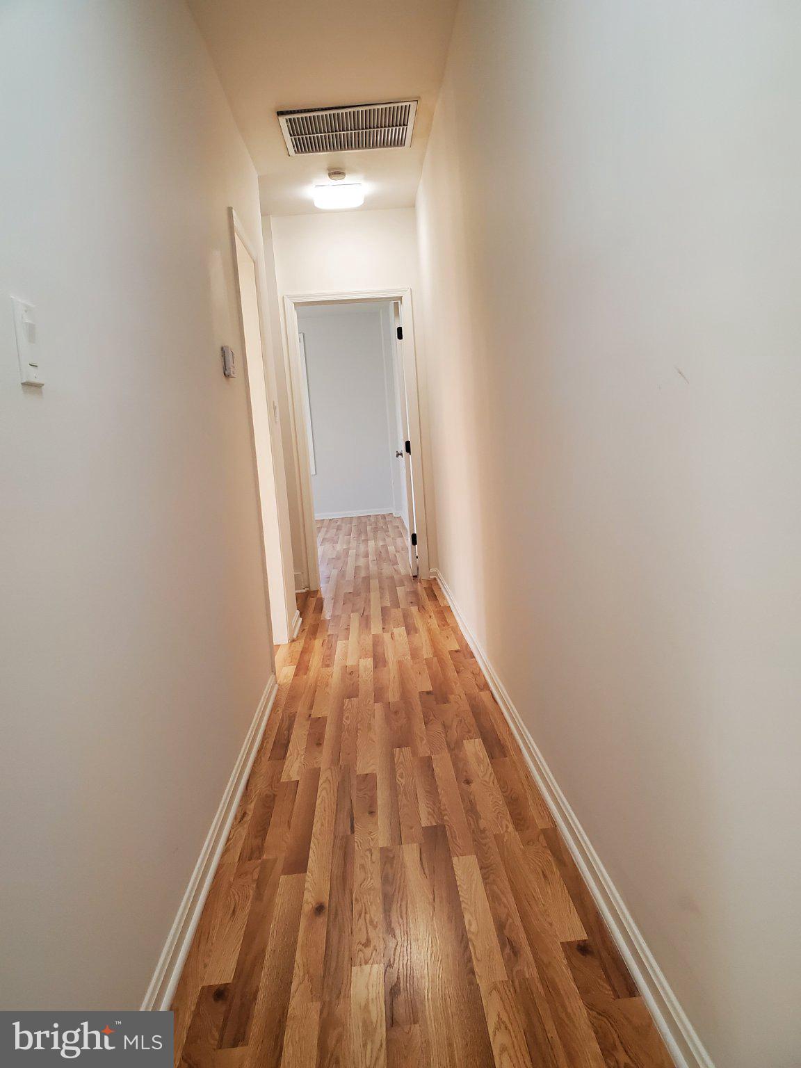 1200 D Street Northeast Washington, DC 20002 - Photo 10 of 35 a view of a hallway with wooden floor