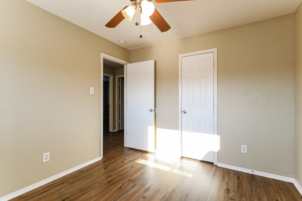 1207 Verde Trails Drive Houston, TX 77073 - Photo 13 of 17 wooden floor in an empty room with a window