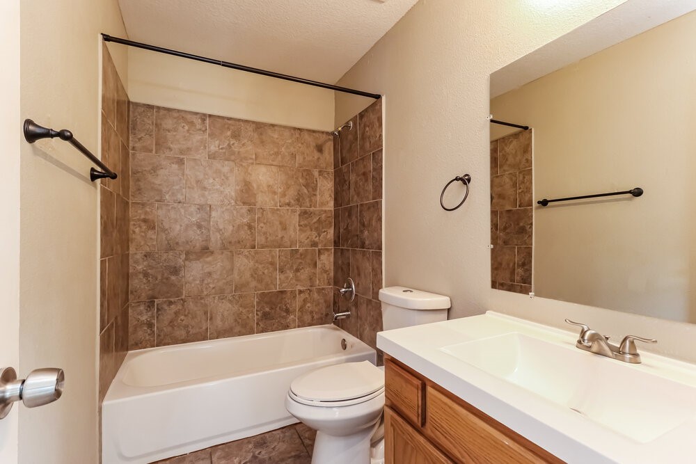 1207 Verde Trails Drive Houston, TX 77073 - Photo 16 of 17 a bathroom with a sink a toilet and shower
