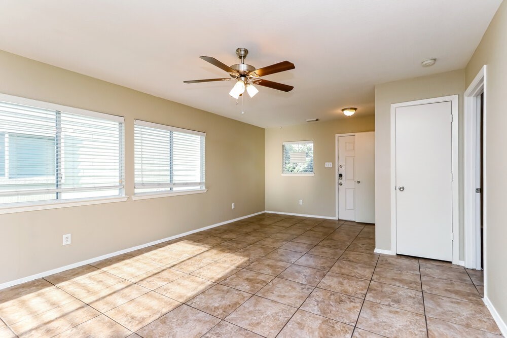 1207 Verde Trails Drive Houston, TX 77073 - Photo 5 of 17 a view of an empty room with window and chandelier fan