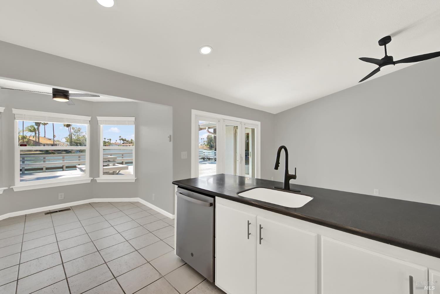 1270 Willow Lake Road Discovery Bay, CA 94505 - Photo 9 of 29 a kitchen with sink and mirror