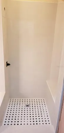 a bathroom with a sink a vanity and a shower