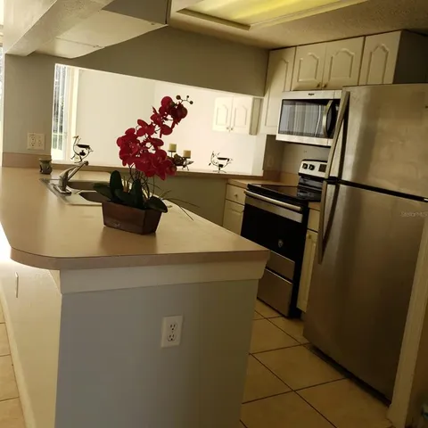 a front view of house with pathway and yard