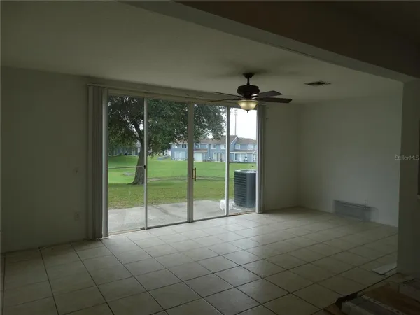 wooden floor and window in an empty room