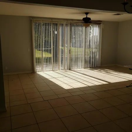 a view of a livingroom with a book shelf
