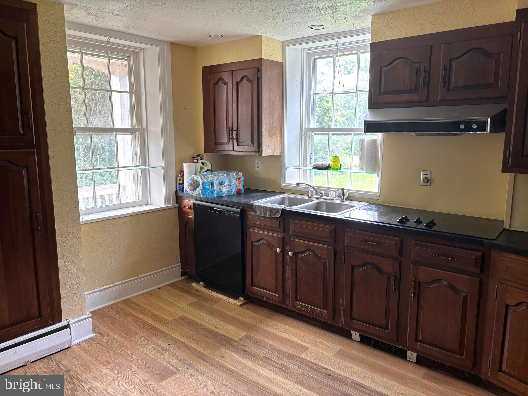 560 Basehoar Roth Road Littlestown, PA 17340 - Photo 6 of 145 a kitchen with granite countertop wooden cabinets a sink and a window