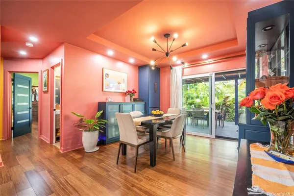 a patio with yard glass top table and chairs