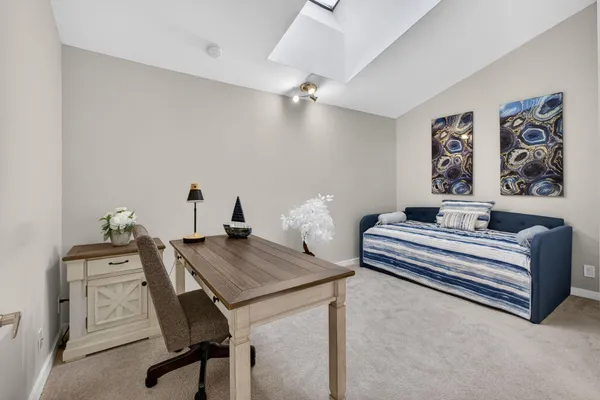 a view of a car parked in front of a house