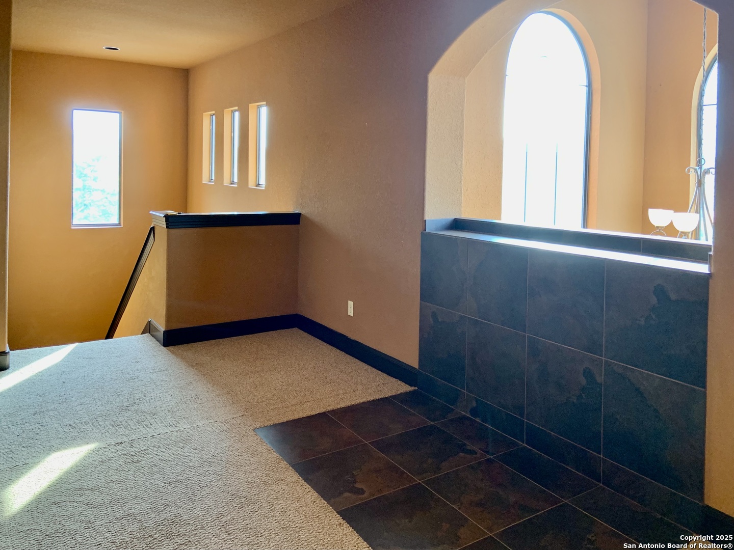 19940 Scenic Loop Road San Antonio, TX 78255 - Photo 16 of 34 a view of a room with wooden floor and windows