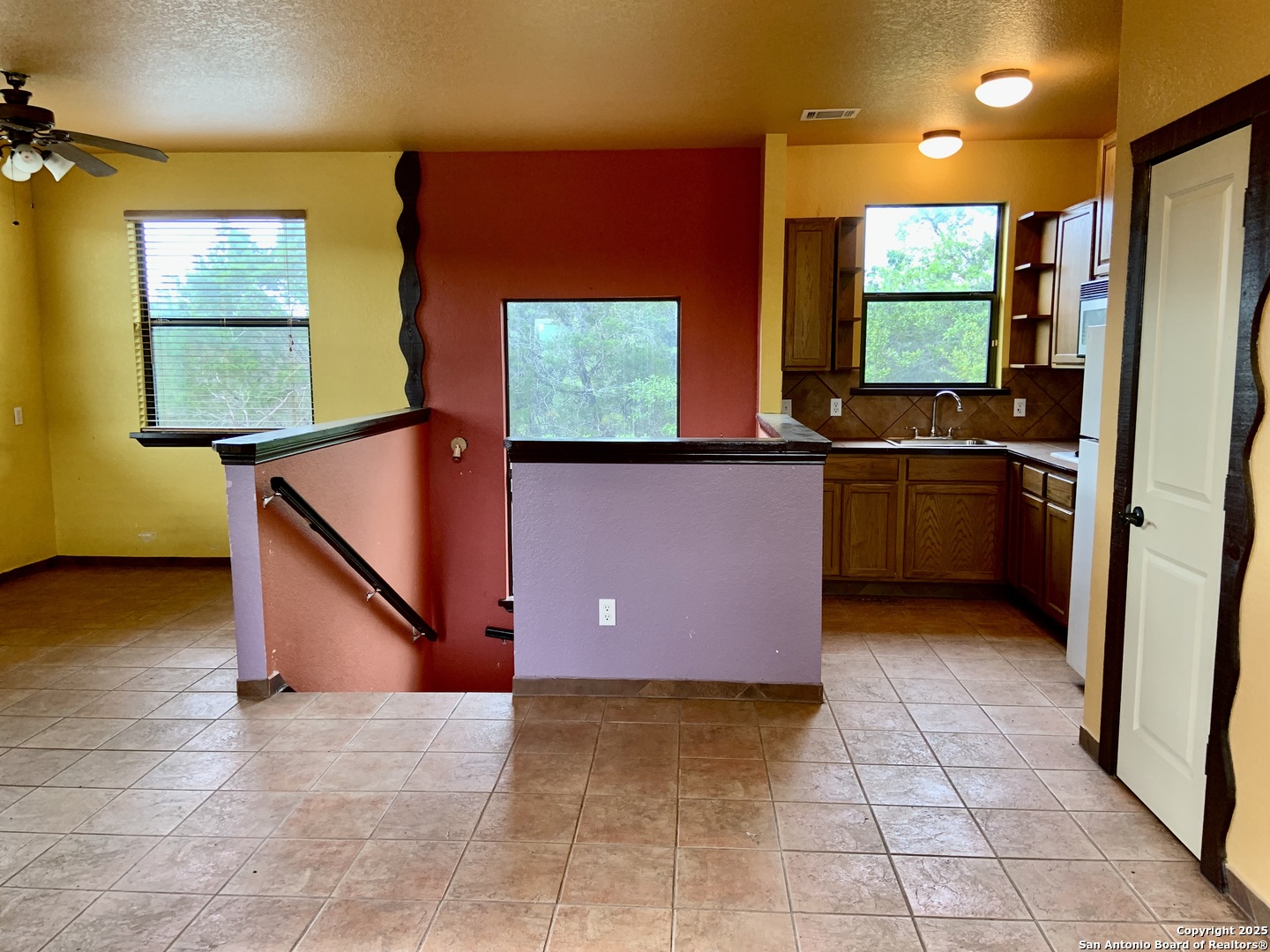 19940 Scenic Loop Road San Antonio, TX 78255 - Photo 29 of 34 a view of a living room with a flat screen tv