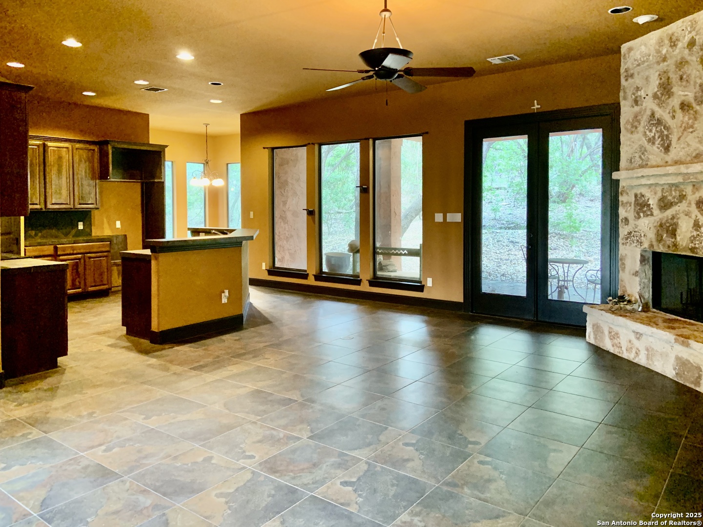 19940 Scenic Loop Road San Antonio, TX 78255 - Photo 4 of 34 a view of a living room with kitchen floor and a large window