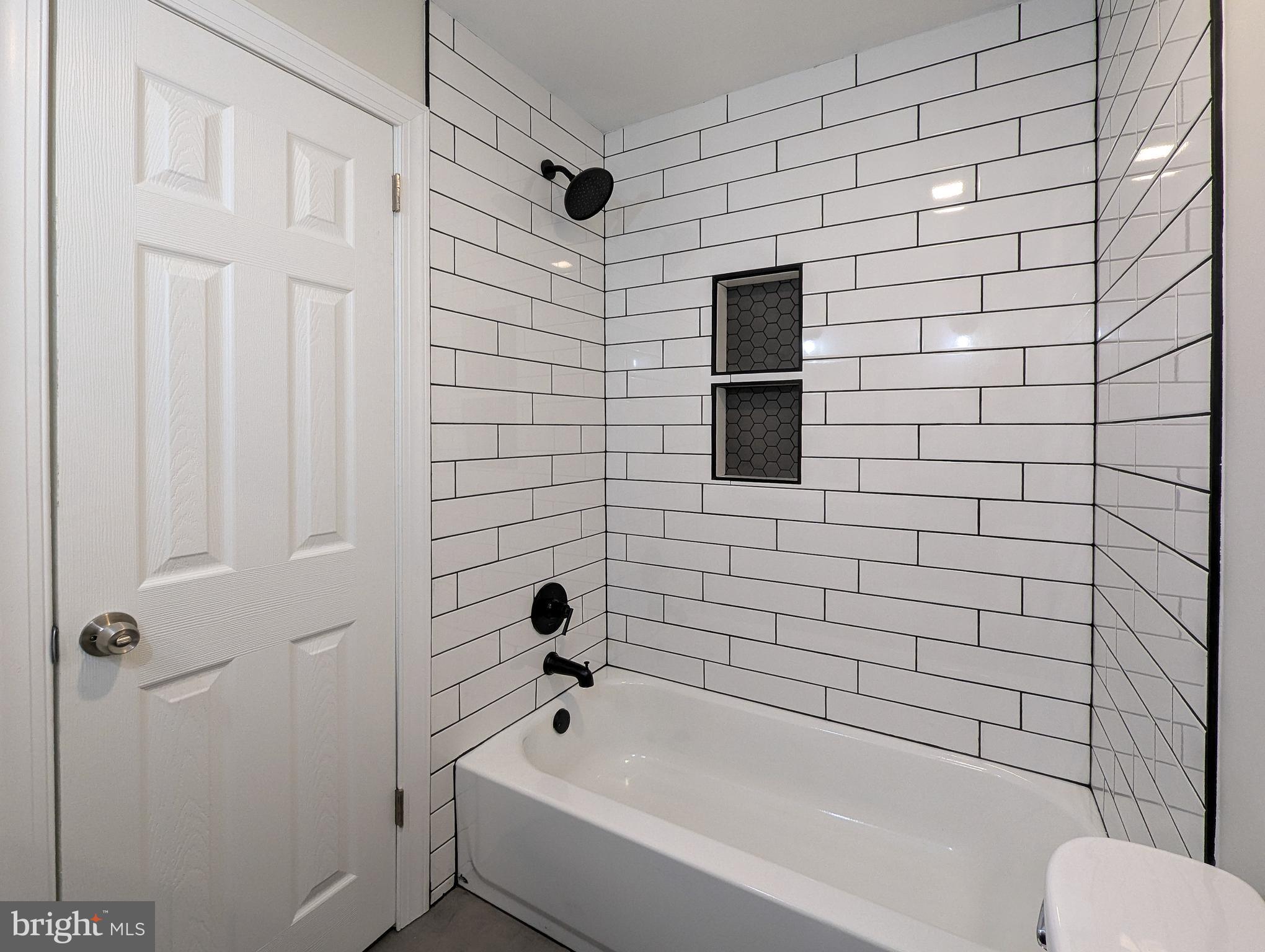 122 Ridge Avenue Perkasie, PA 18944 - Photo 36 of 44 a bathroom with a toilet and a bathtub
