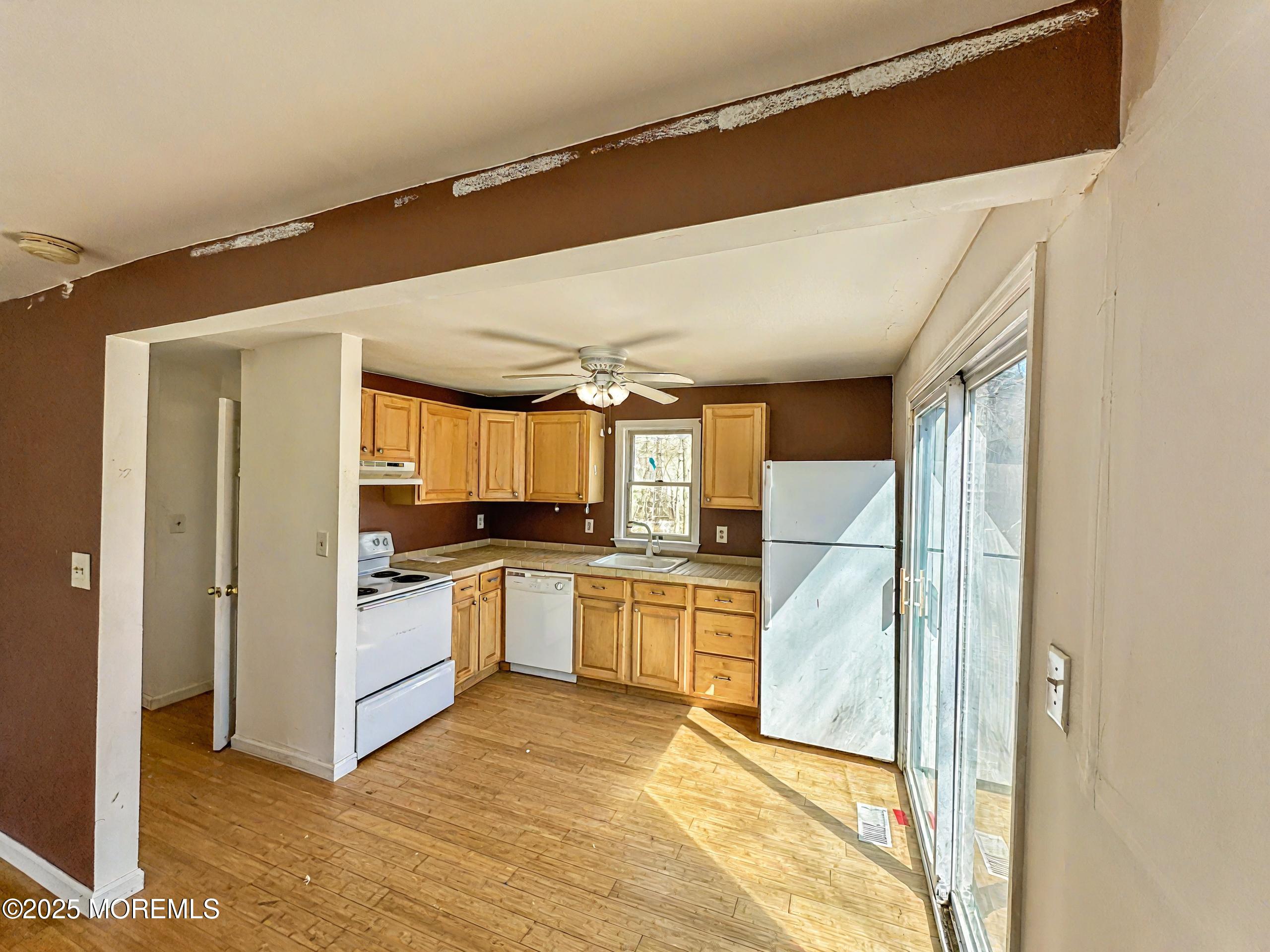 198 Lemon Road Farmingdale, NJ 07727 - Photo 4 of 13 a kitchen with a sink stainless steel appliances furniture and a window