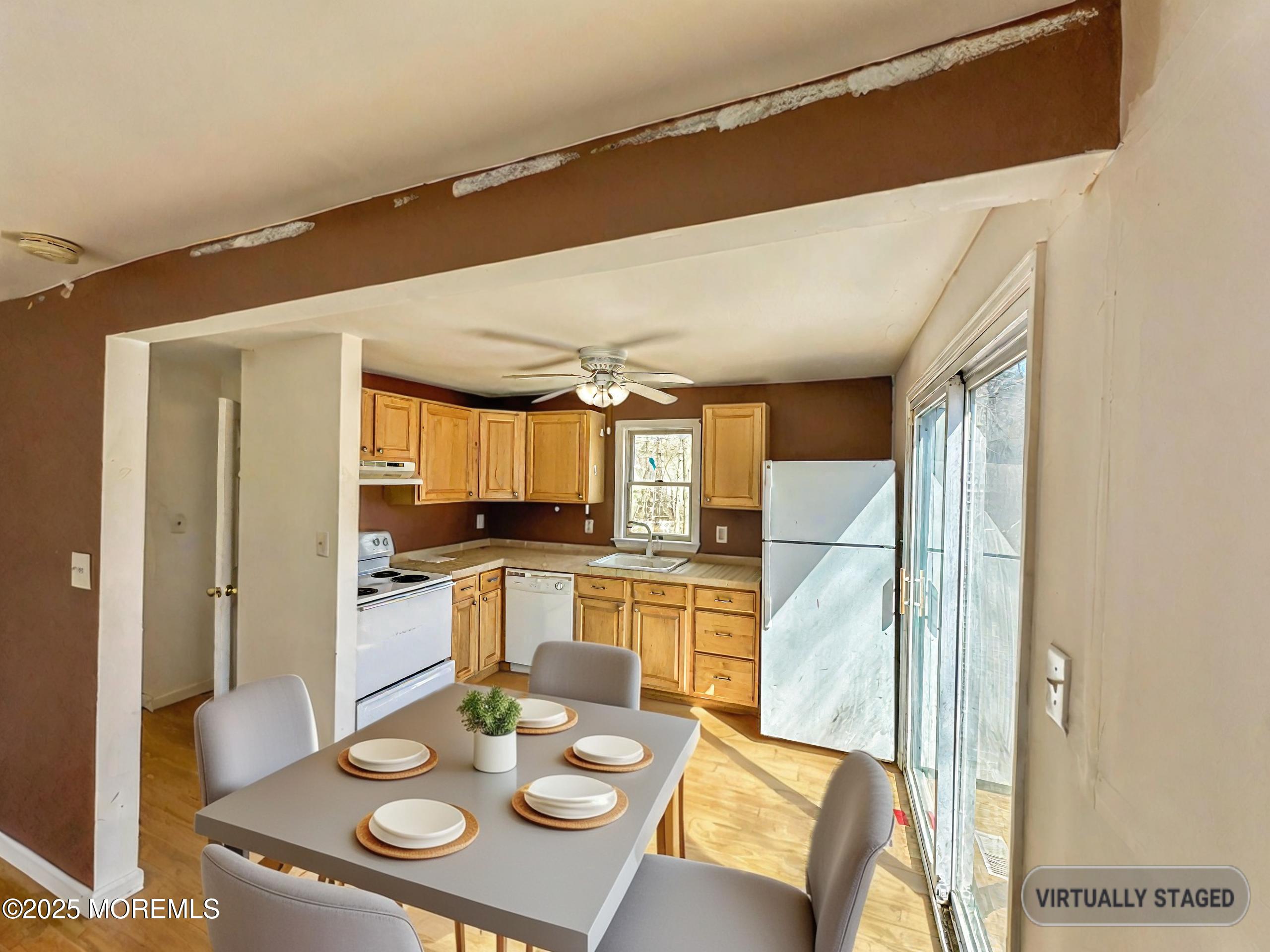 198 Lemon Road Farmingdale, NJ 07727 - Photo 5 of 13 a kitchen with a sink dishwasher a stove and a dining table with kitchen view