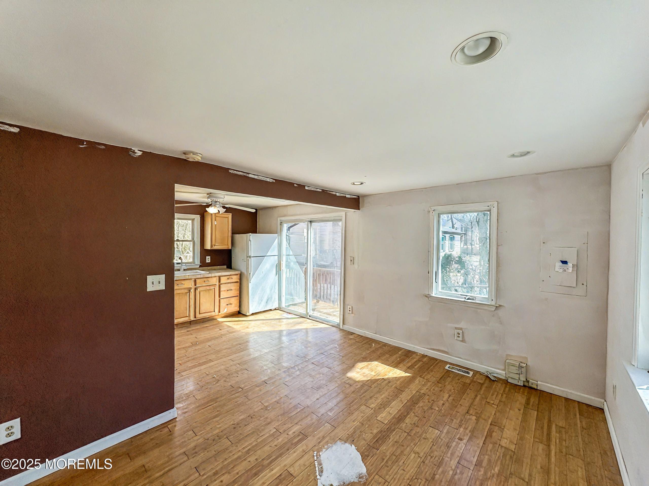 198 Lemon Road Farmingdale, NJ 07727 - Photo 8 of 13 wooden floor in an empty room with a window