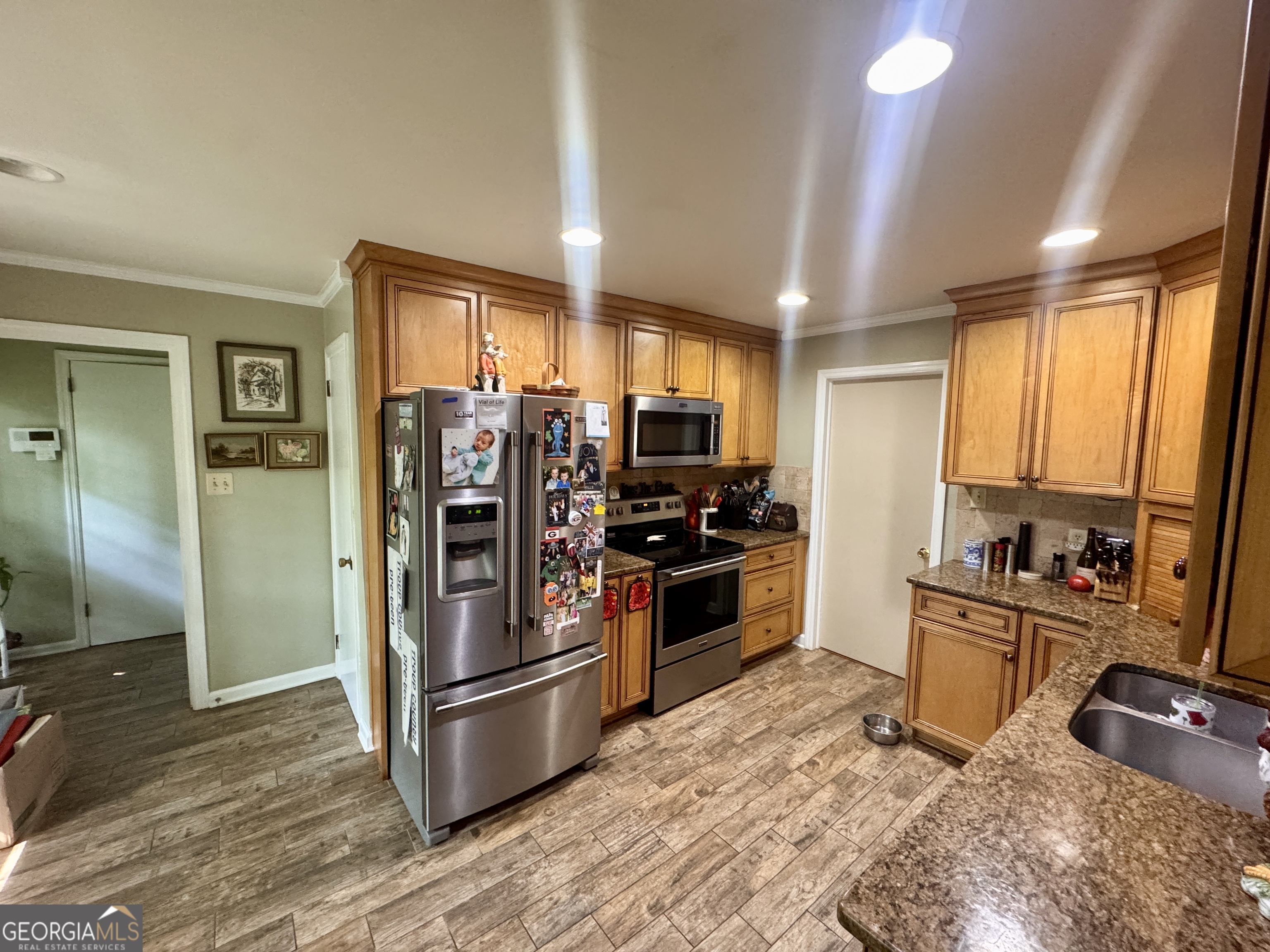 601 Cherokee Road LaGrange, GA 30240 - Photo 11 of 37 a kitchen with stainless steel appliances granite countertop a refrigerator stove and sink