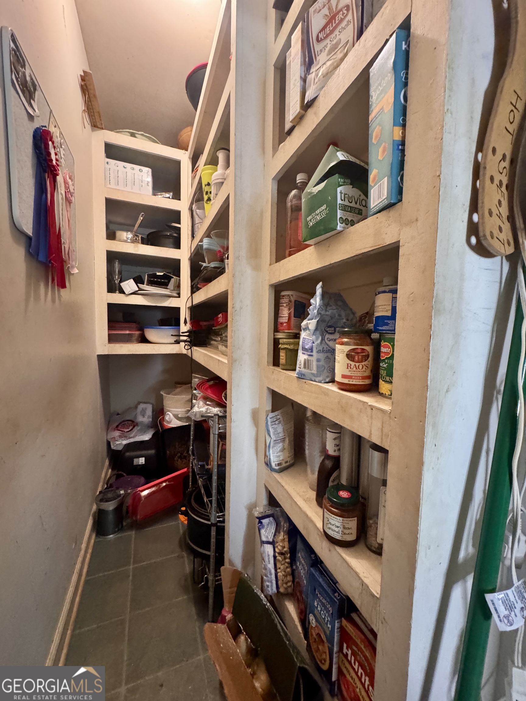 601 Cherokee Road LaGrange, GA 30240 - Photo 13 of 37 a view of walk in closet with clothes and shoes