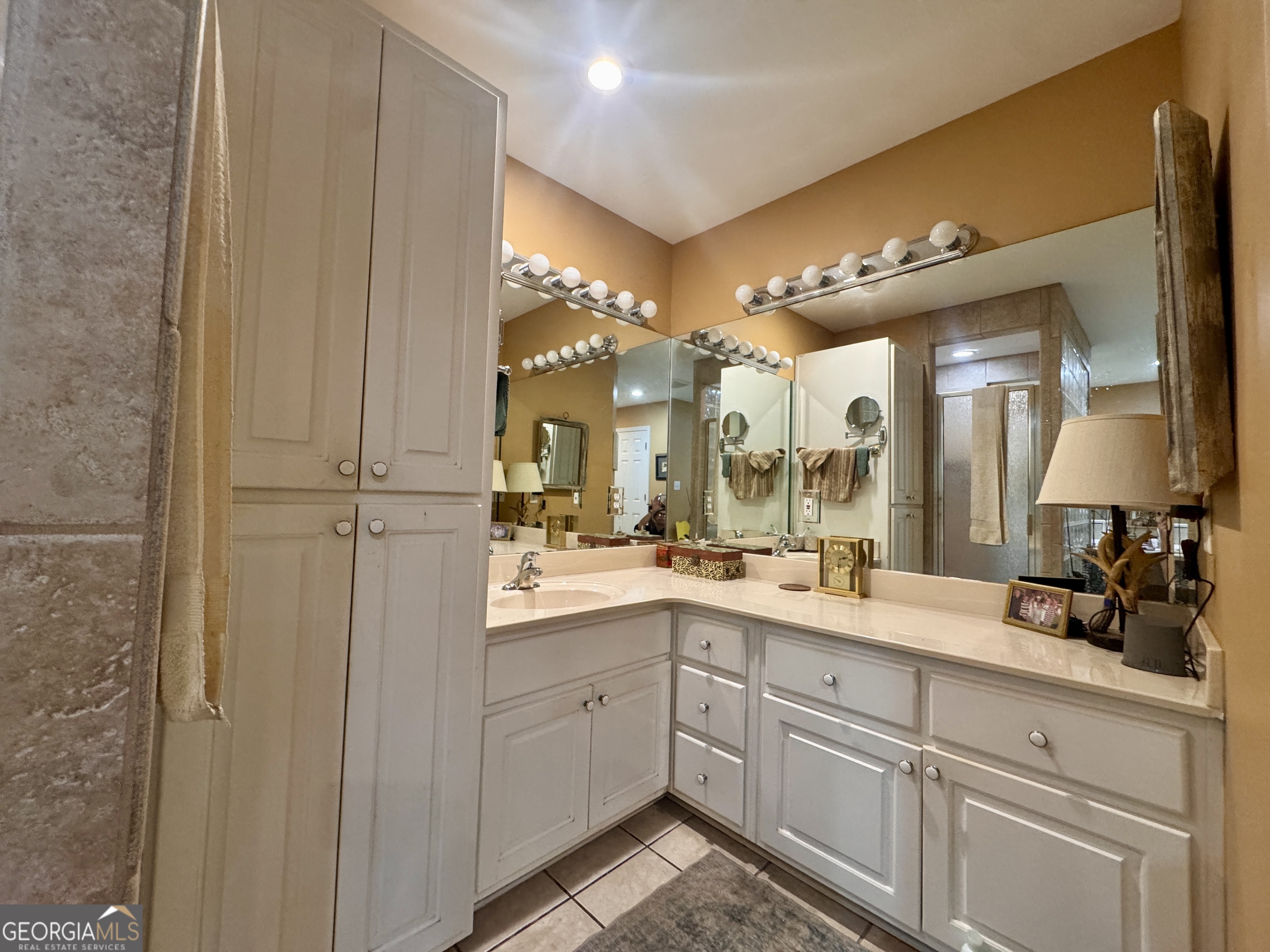 601 Cherokee Road LaGrange, GA 30240 - Photo 28 of 37 a bathroom with a double vanity sink and mirror with shower