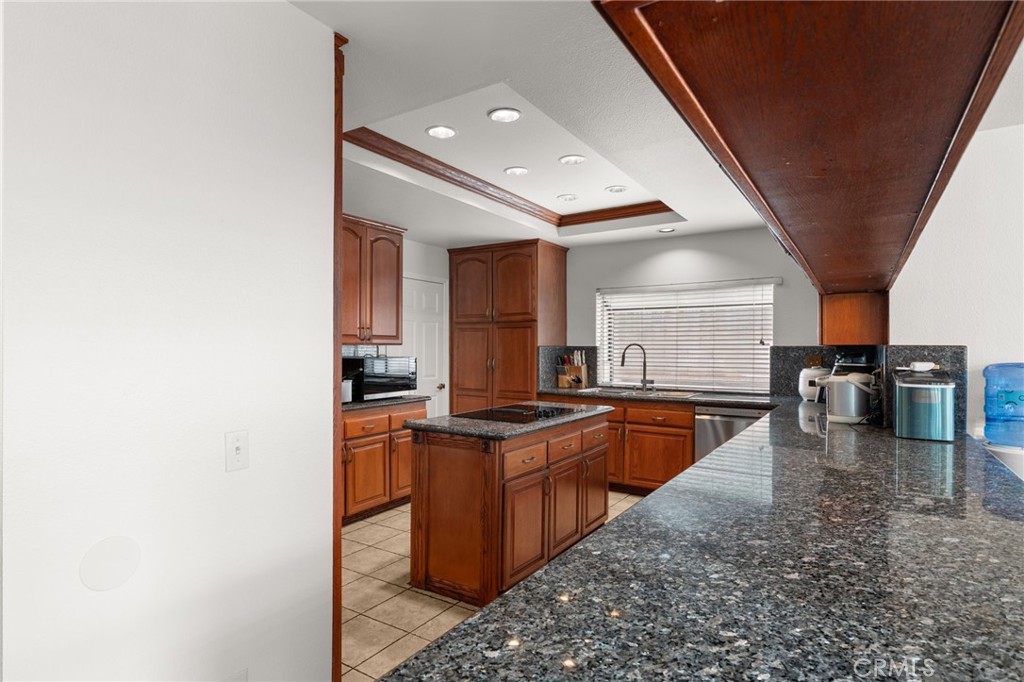 12732 Arena Drive Rancho Cucamonga, CA 91739 - Photo 18 of 61 a kitchen with stainless steel appliances granite countertop a sink dishwasher stove and oven