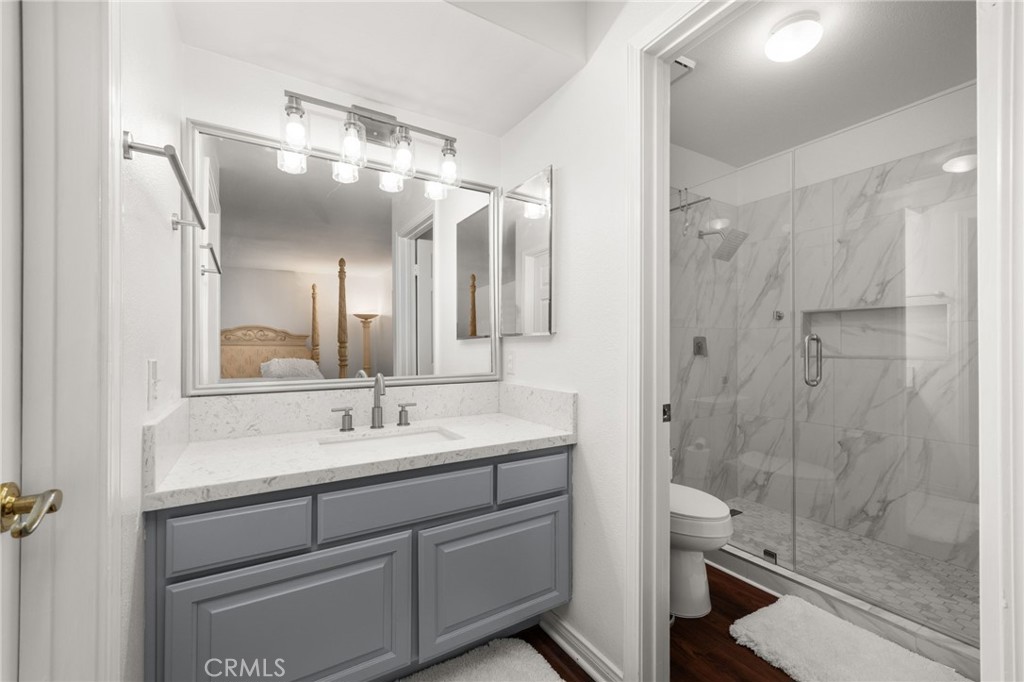 12732 Arena Drive Rancho Cucamonga, CA 91739 - Photo 28 of 61 a bathroom with a double vanity sink mirror and shower