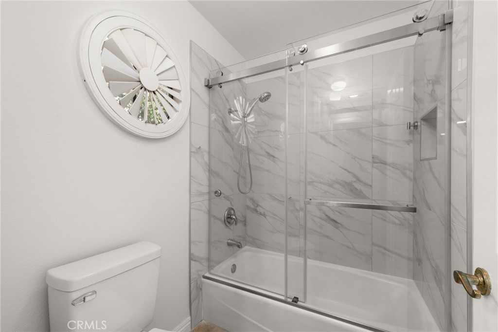 12732 Arena Drive Rancho Cucamonga, CA 91739 - Photo 39 of 61 a bathroom with a shower a toilet and a sink