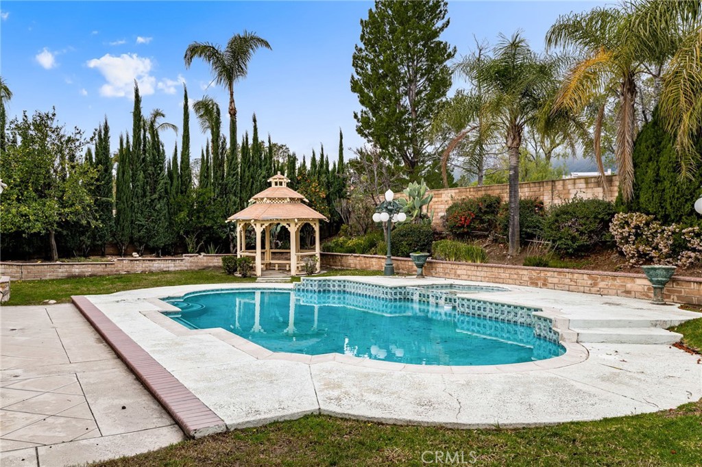 12732 Arena Drive Rancho Cucamonga, CA 91739 - Photo 43 of 61 a view of a swimming pool with a yard