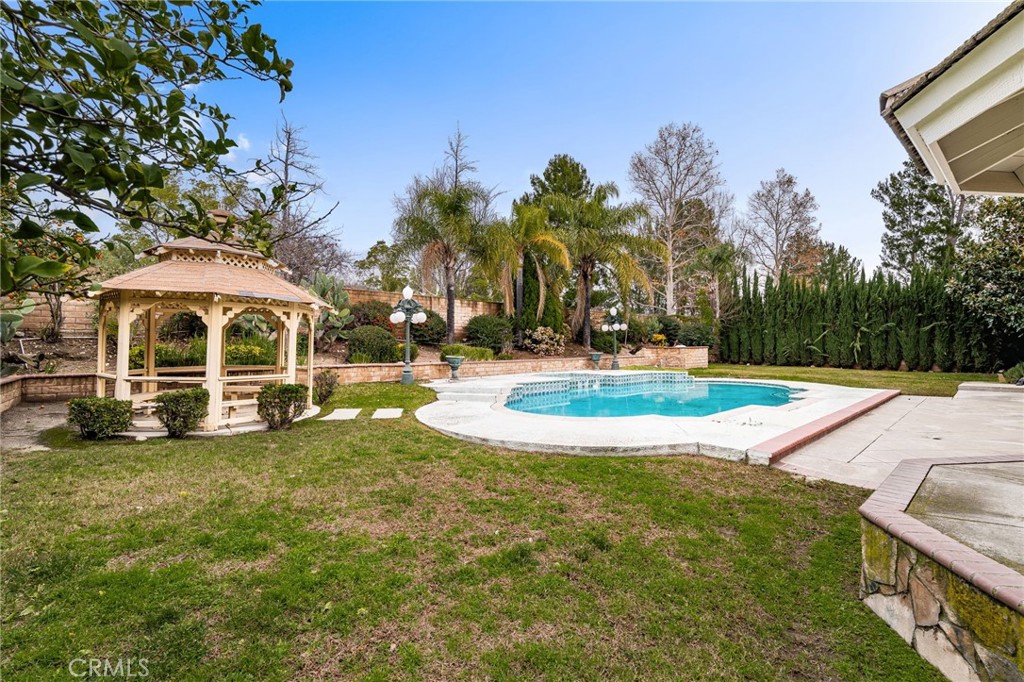 12732 Arena Drive Rancho Cucamonga, CA 91739 - Photo 44 of 61 a view of a house with swimming pool and yard