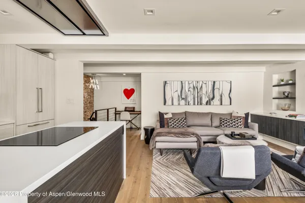 a living room with furniture and a table