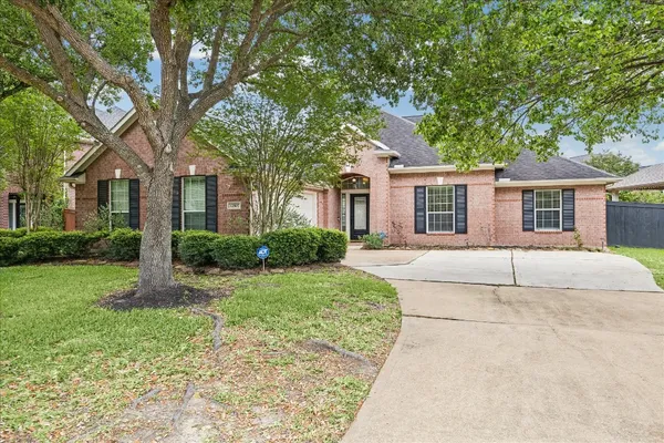 a kitchen with stainless steel appliances granite countertop a sink a stove a microwave and a refrigerator