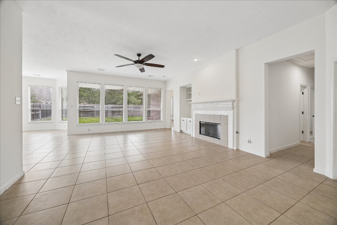 12507 Aliso Bend Lane Houston, TX 77041 - Photo 11 of 25 a view of an empty room with a fireplace