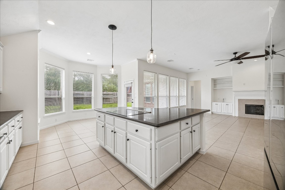 12507 Aliso Bend Lane Houston, TX 77041 - Photo 13 of 25 a large white kitchen with a large window