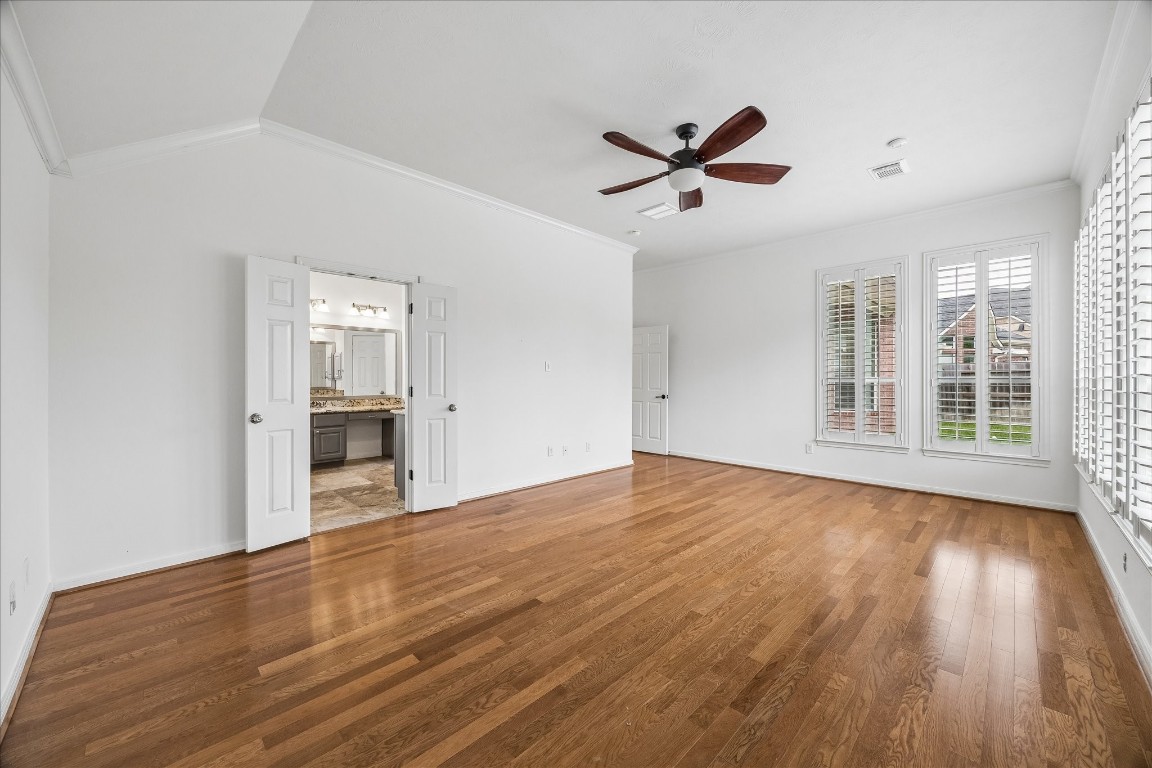 12507 Aliso Bend Lane Houston, TX 77041 - Photo 16 of 25 a view of empty room with wooden floor and fan